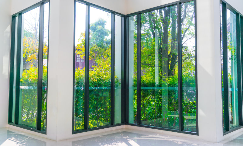 Glass window overlooking green garden<br />